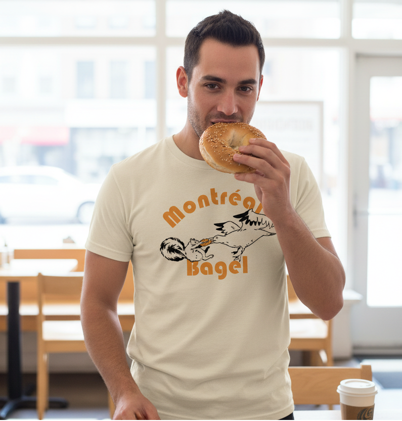 Beige t-shirt with 'Montréal Bagel' text and graphic on a white background